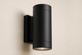 AfterDusk Halo Wall Light — matte black up-down sconce, studio